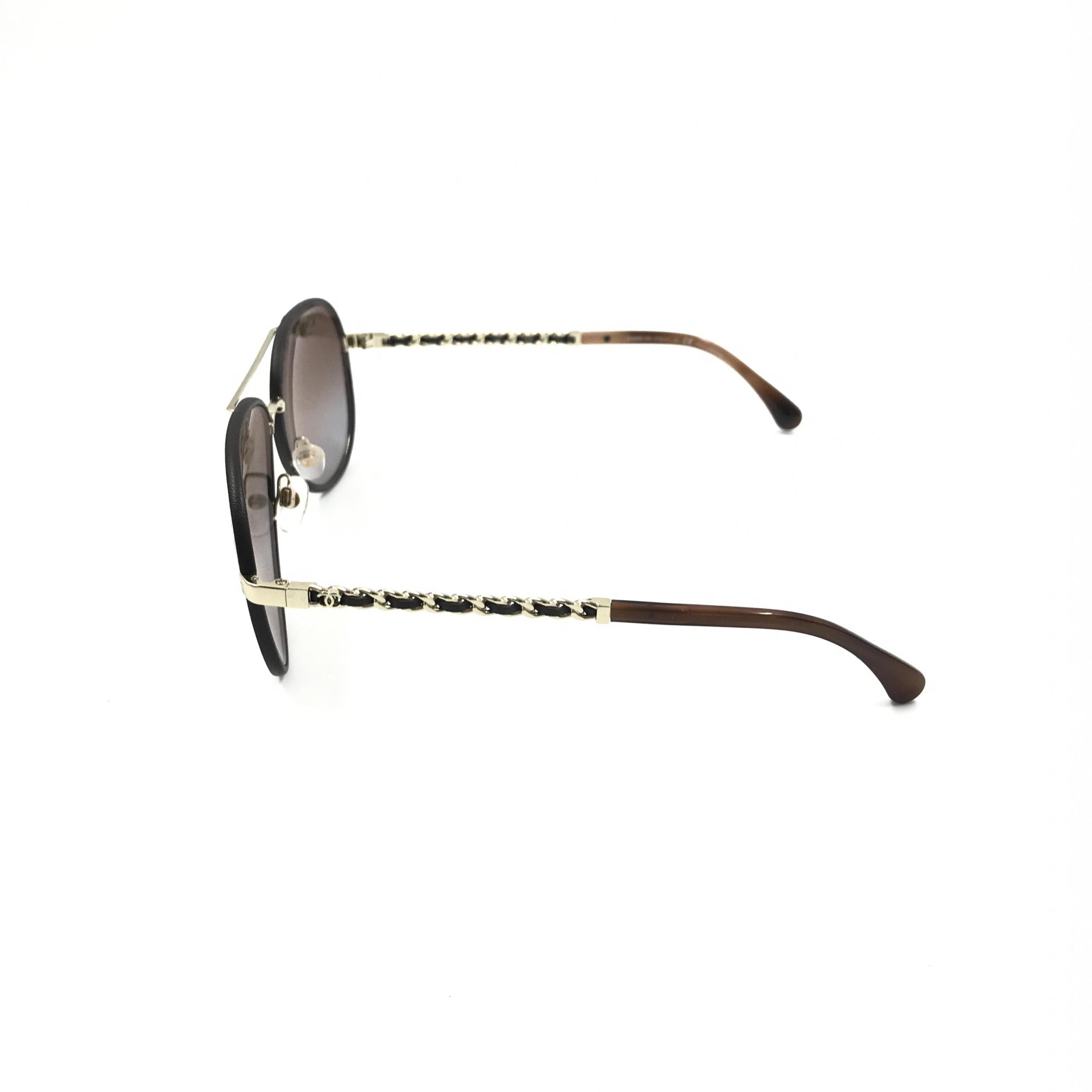 Pre-loved Chanel gold and black polarized aviator sunglasses with protective case