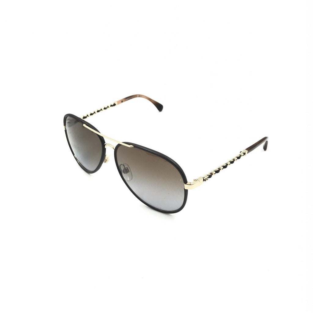 Pre-loved Chanel gold and black polarized aviator sunglasses with protective case