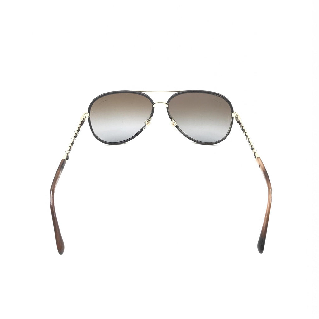 Pre-loved Chanel gold and black polarized aviator sunglasses with protective case