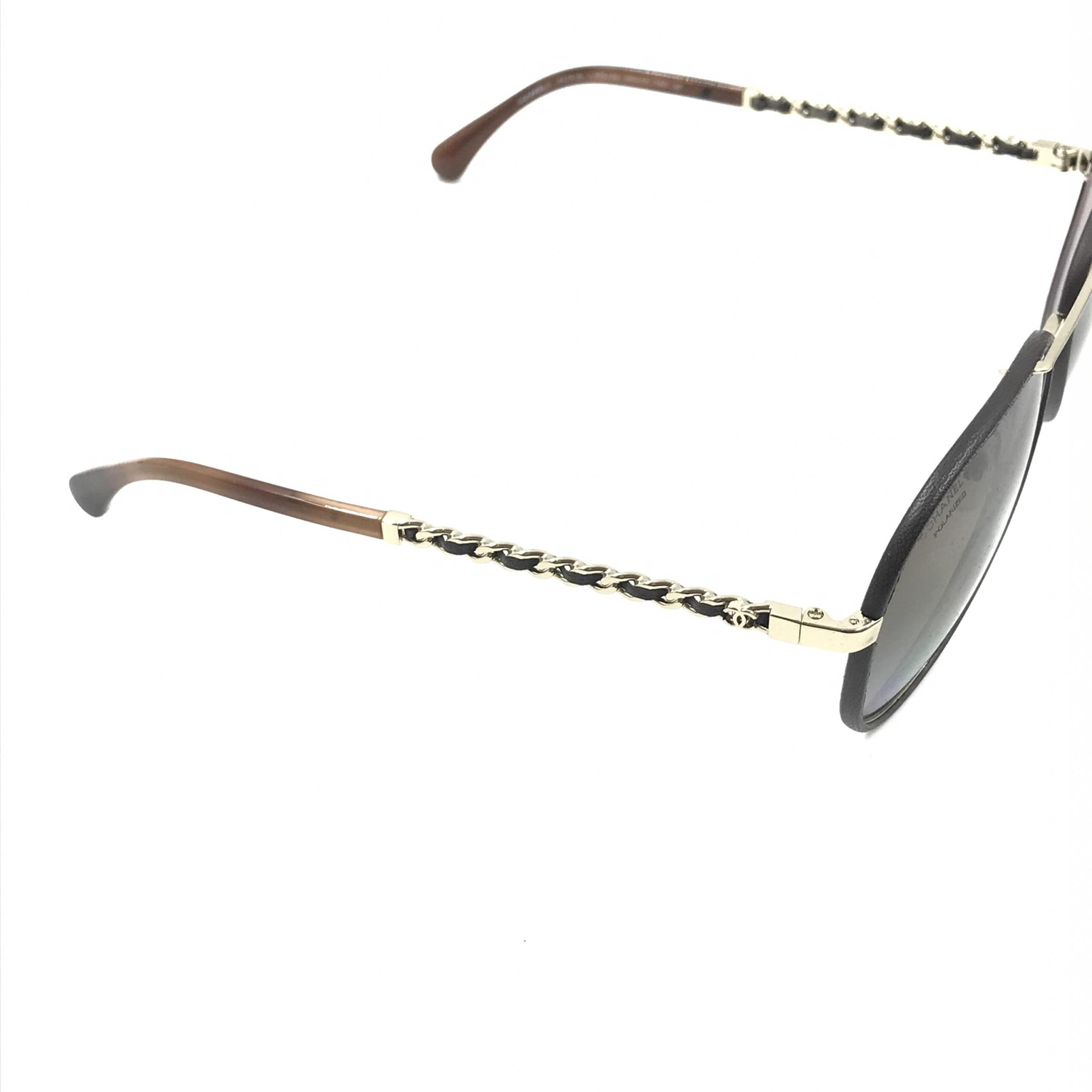 Pre-loved Chanel gold and black polarized aviator sunglasses with protective case