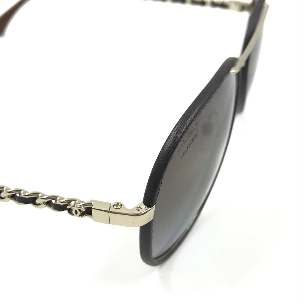 Pre-loved Chanel gold and black polarized aviator sunglasses with protective case