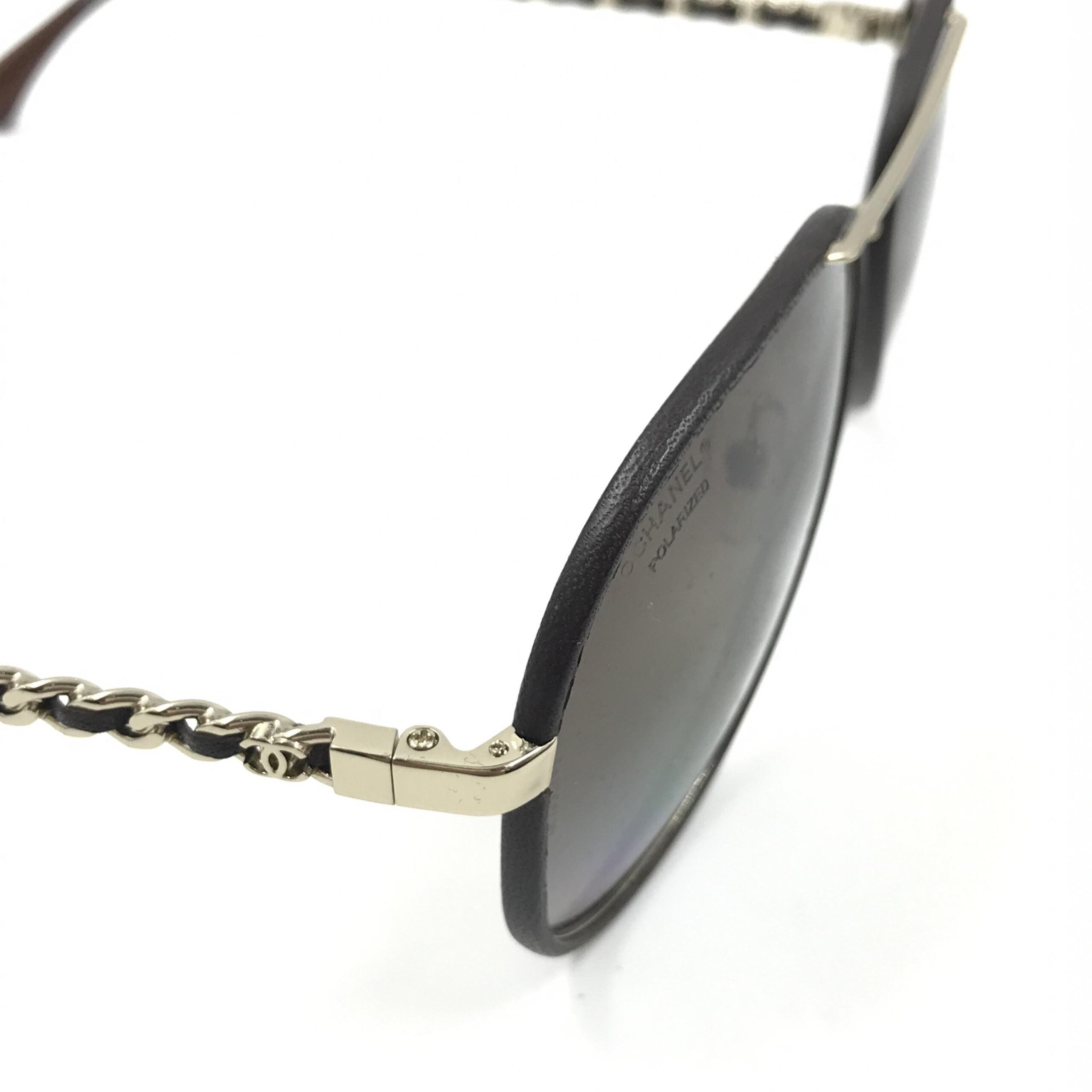 Pre-loved Chanel gold and black polarized aviator sunglasses with protective case