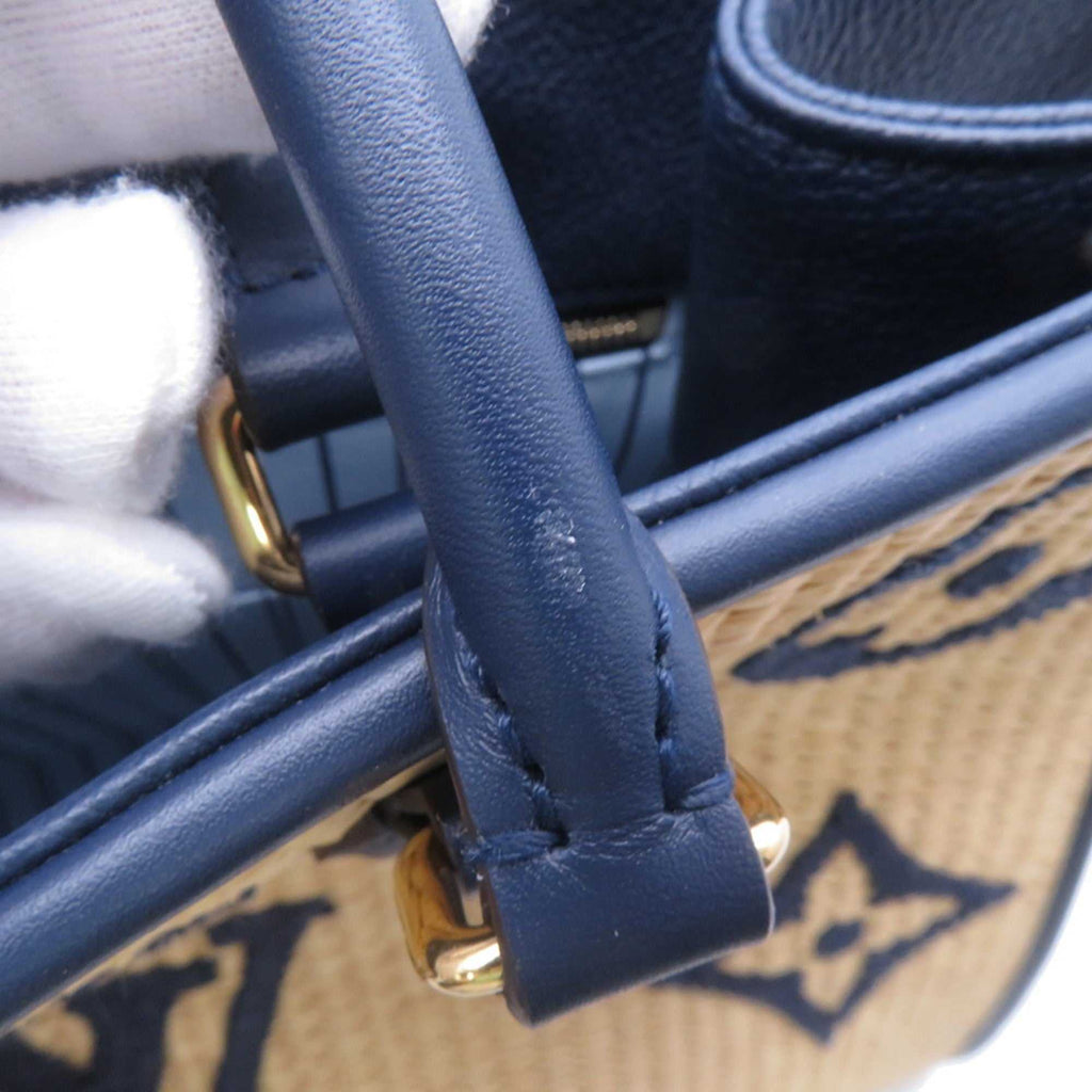Close-up of MANSII LOUIS VUITTON Pre-Loved Monogram Raffia On-the-Go tote bag handle showing quality craftsmanship