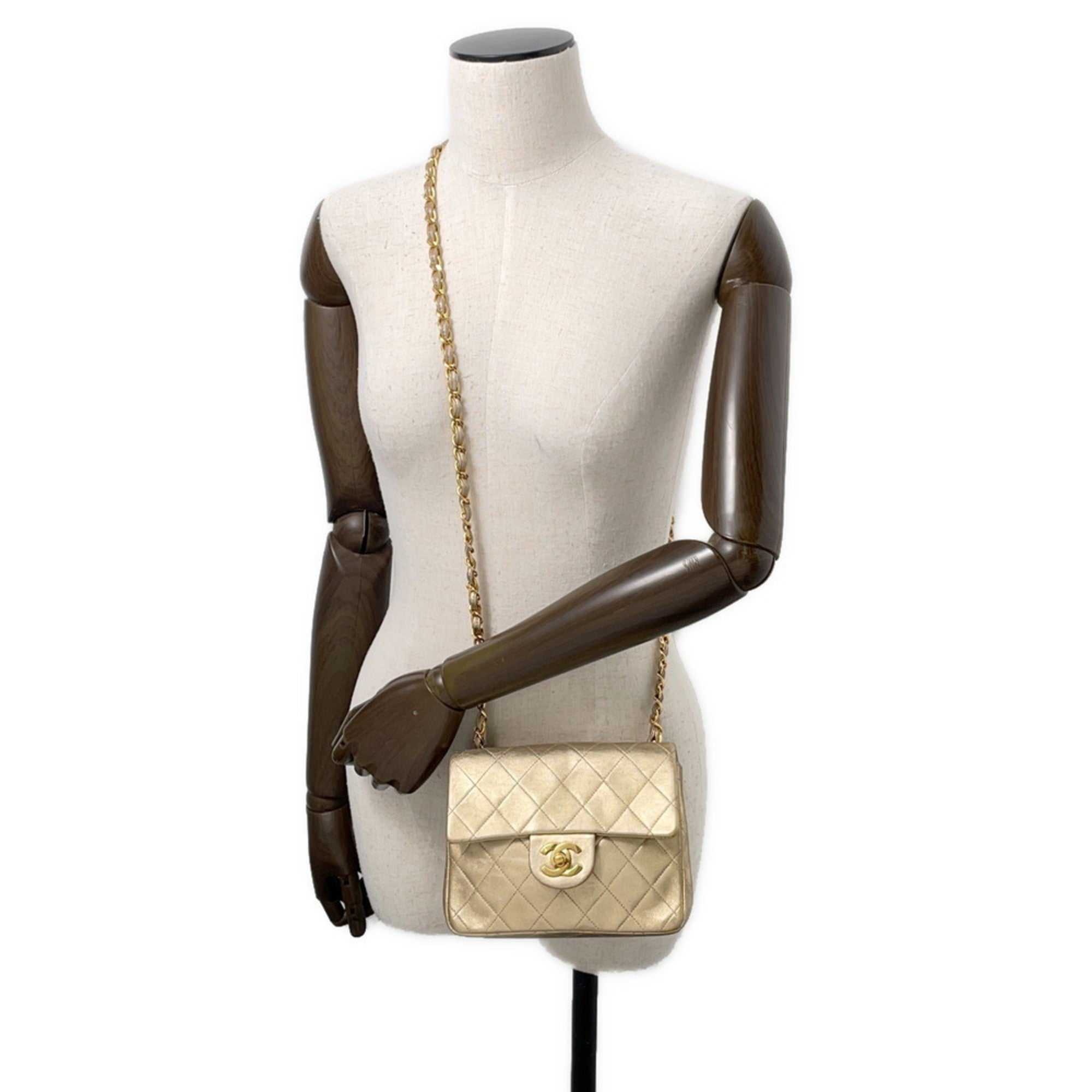 Authentic Chanel Matelasse 18 for sale displayed on a mannequin with chain strap and quilted design