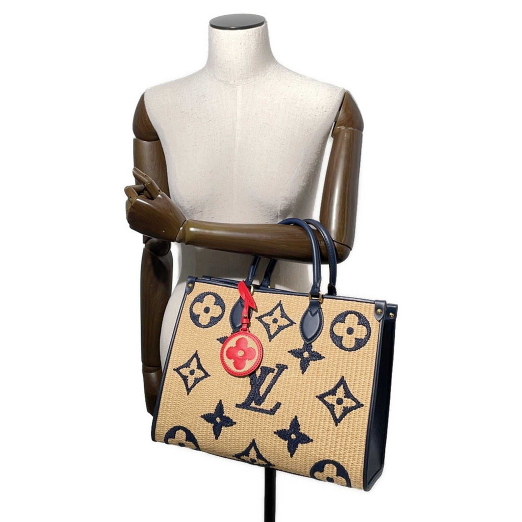 MANSII LOUIS VUITTON Pre-Loved Monogram Raffia On-the-Go tote bag displayed on a mannequin