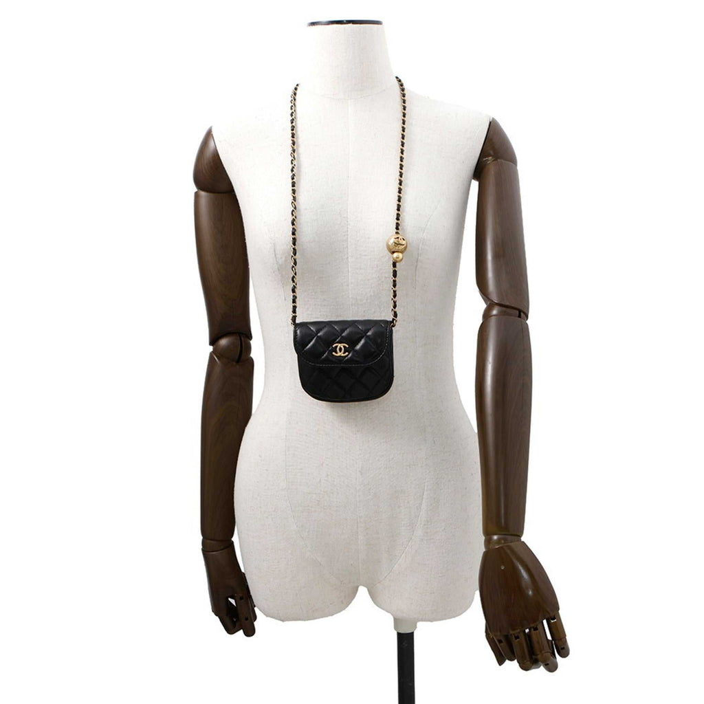 MANSII Chanel used Ball Bag on a mannequin showcasing its stylish quilted design and gold accents