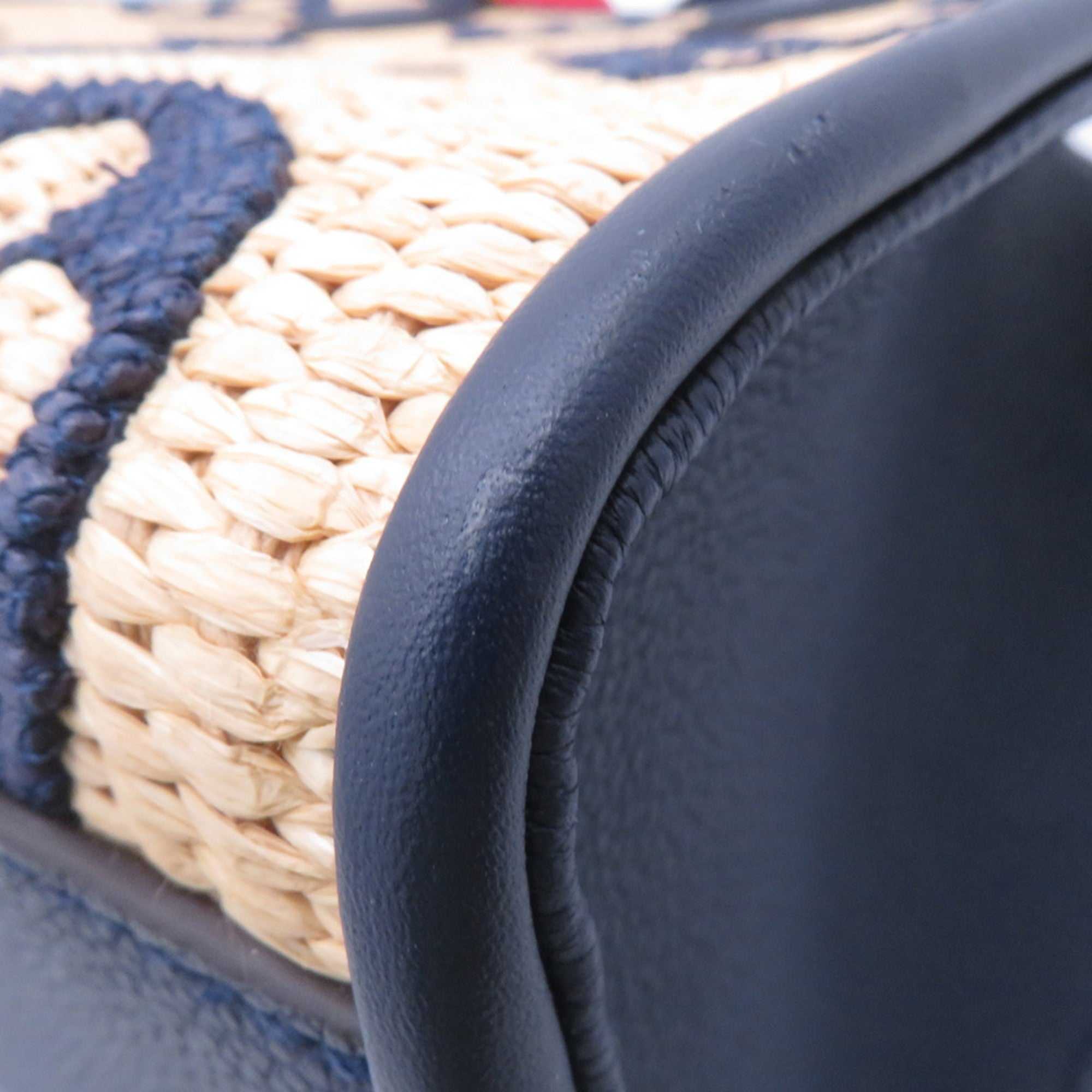 LOUIS VUITTON Pre-Loved Monogram Raffia On-the-Go tote bag showing detailed stitching and textured material