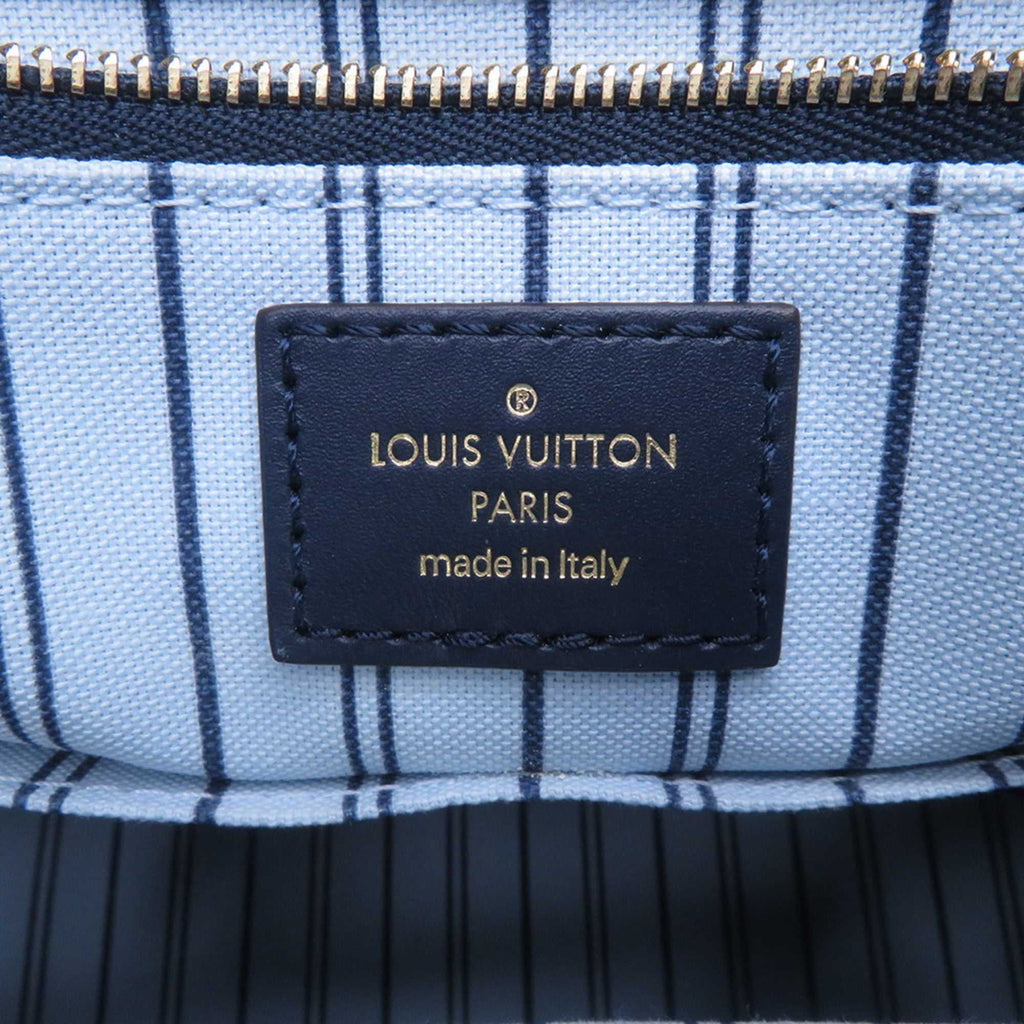 Inner lining of LOUIS VUITTON Pre-Loved Monogram Raffia On-the-Go tote bag featuring a logo tag