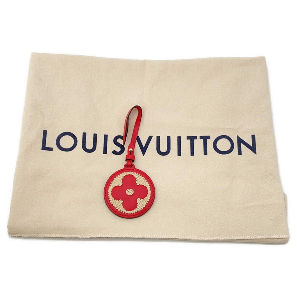 MANSII LOUIS VUITTON Pre-Loved Monogram Raffia On-the-Go tote bag displayed with dust cover