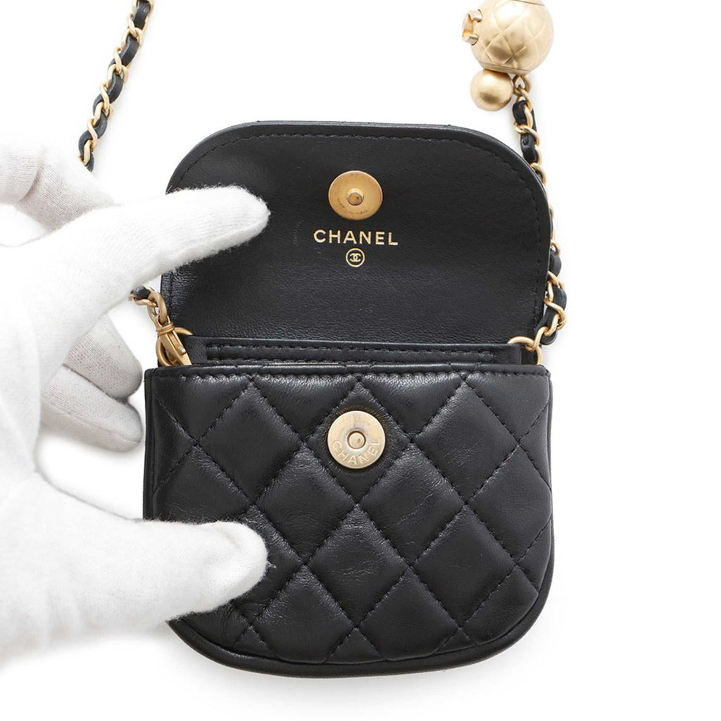MANSII Chanel used Ball Bag in black leather with quilted design and gold-tone hardware.