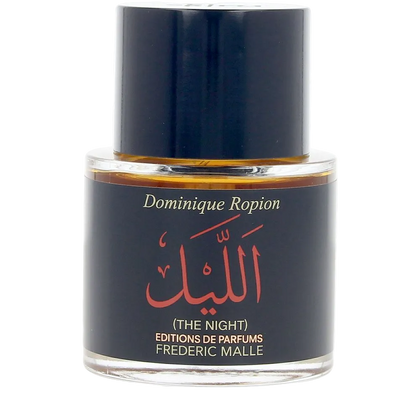 Perfume bottle labeled 'The Night' by Frederic Malle on a white background