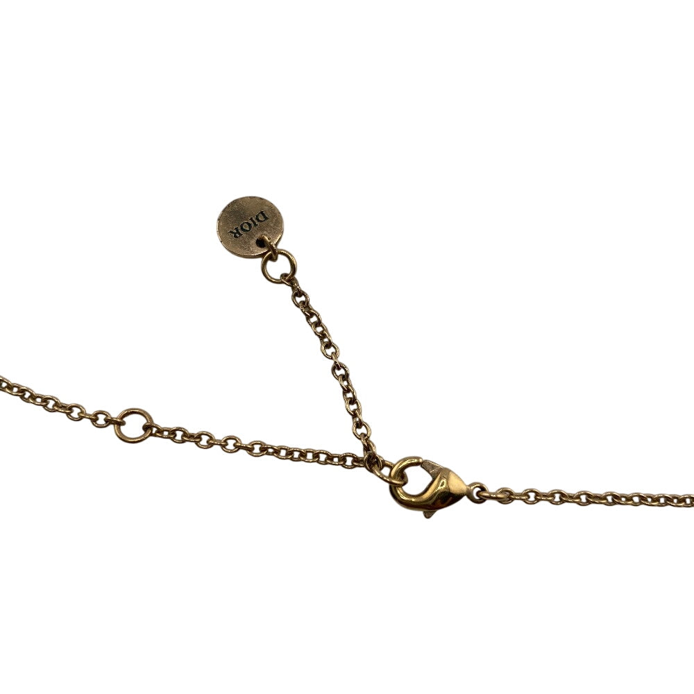 Elegant gold chain necklace with authentic Dior tag, featuring a classic design for stylish accessorizing
