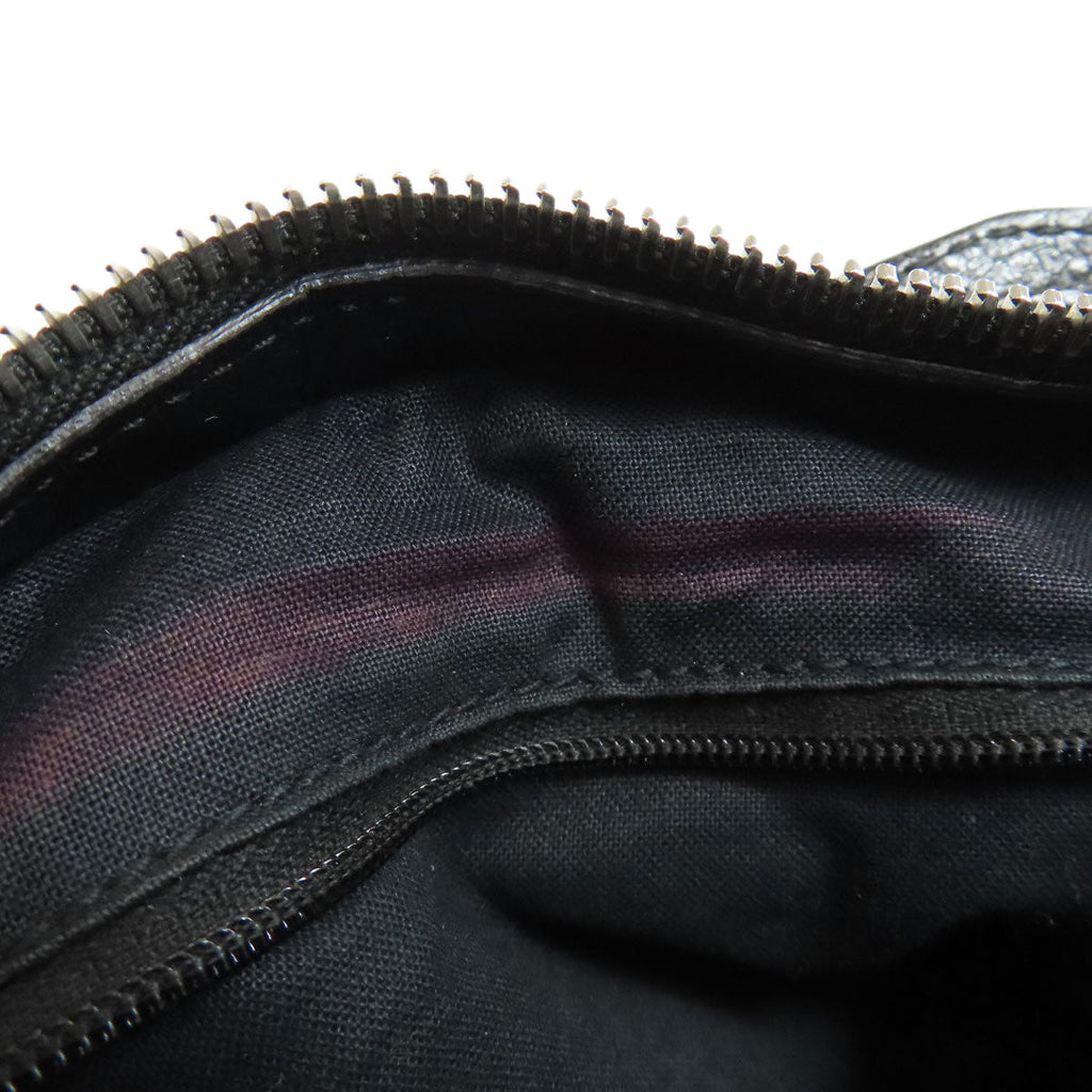 Inside view of BALENCIAGA Vintage Bag with a sleek black lining and zippered closure