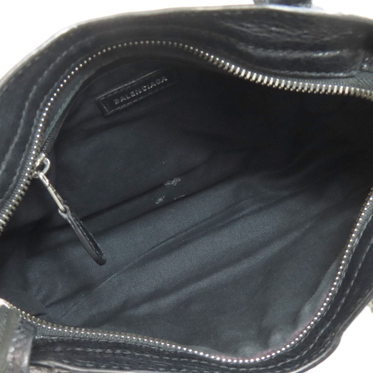 Inside view of BALENCIAGA vintage bag showcasing spacious black interior with zipper closure