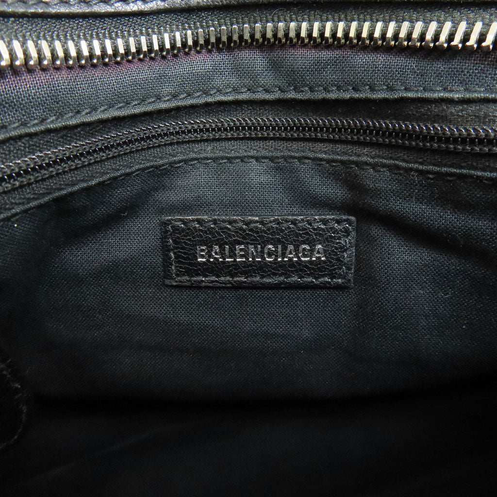 Interior of BALENCIAGA vintage bag showing the logo tag and zipper details