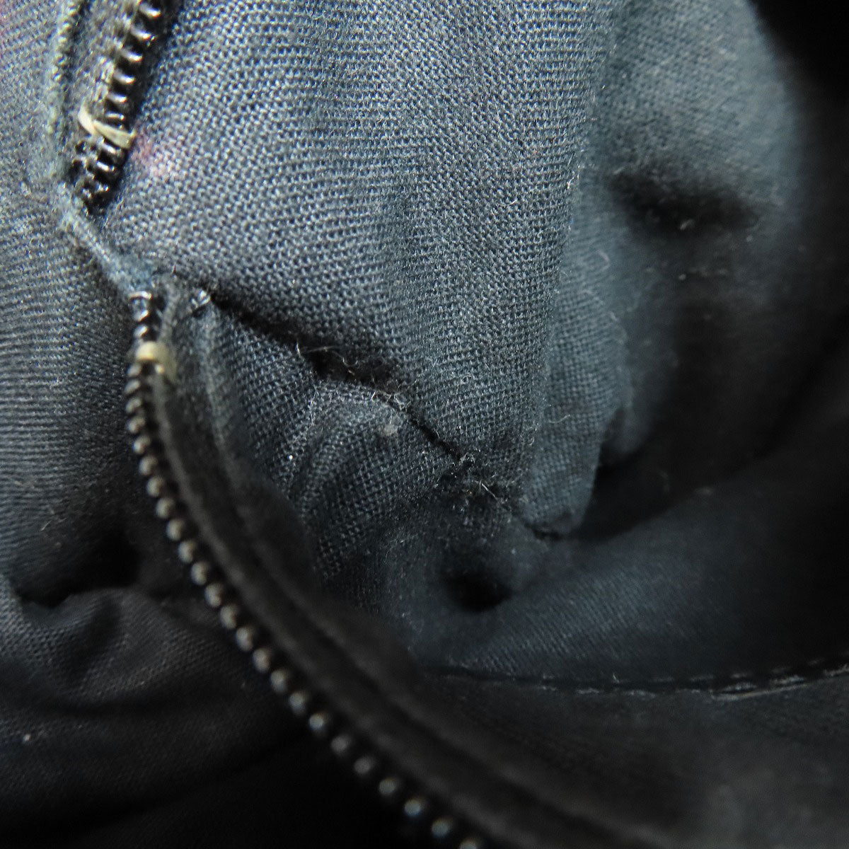 Interior view of a BALENCIAGA Vintage bag showcasing the black fabric and zipper details
