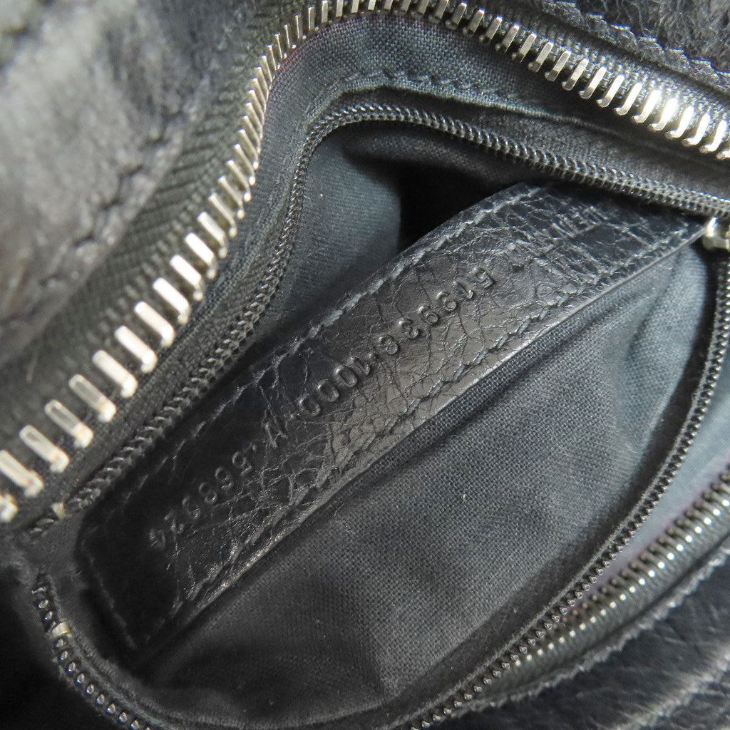 Interior view of a BALENCIAGA bag showcasing vintage style with smooth lining and zipper details