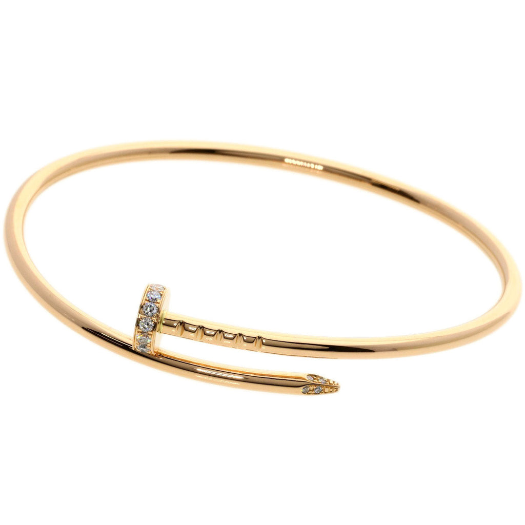 Elegant gold Cartier Juste un Clou bracelet for sale with diamond embellishments and a unique nail design