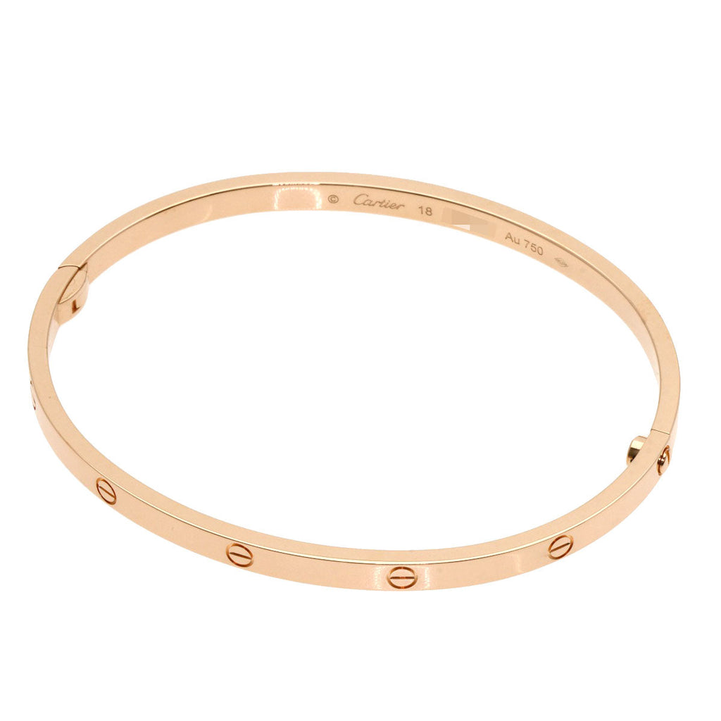 Elegant Cartier Love bracelet used in 18K rose gold with classic screw design for timeless style