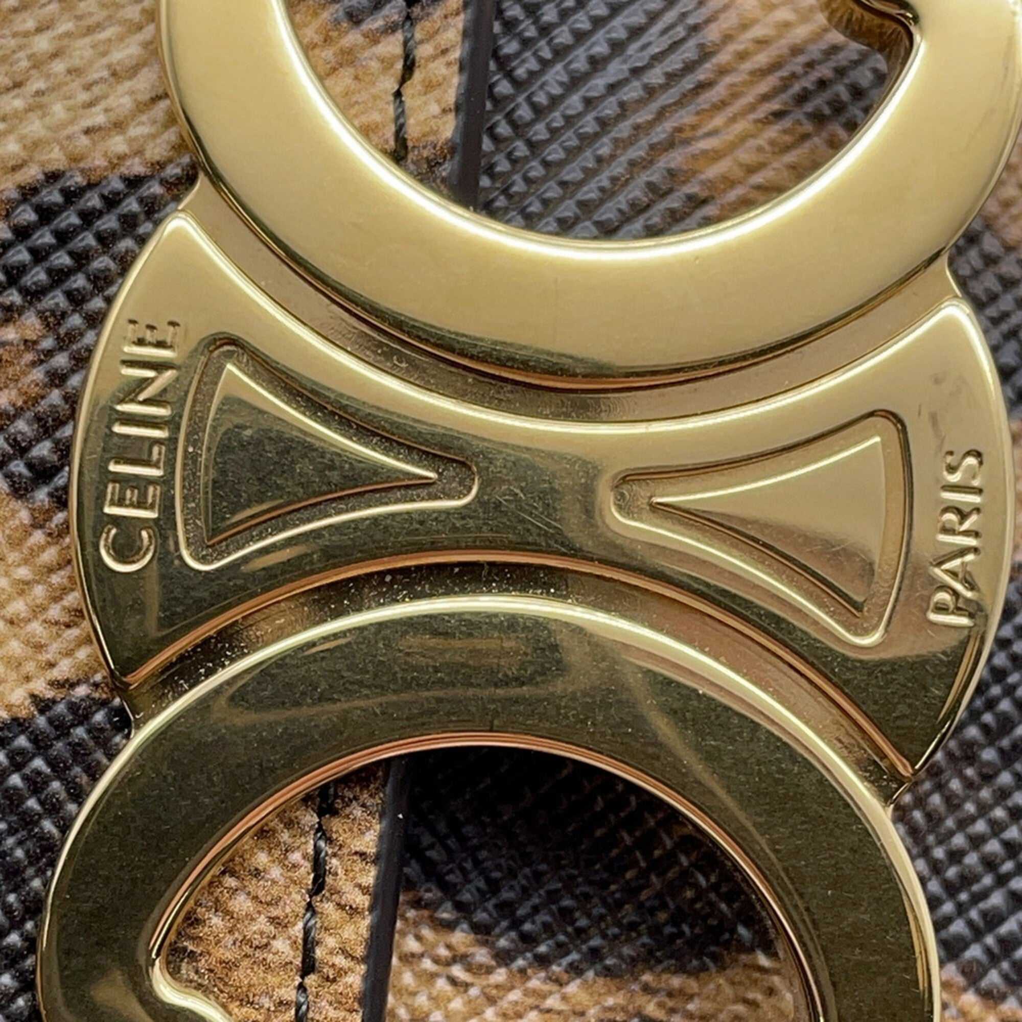 Close-up of CÉLINE Pre-Loved Mini Claude crossbody bag hardware showcasing gold details and signature logo