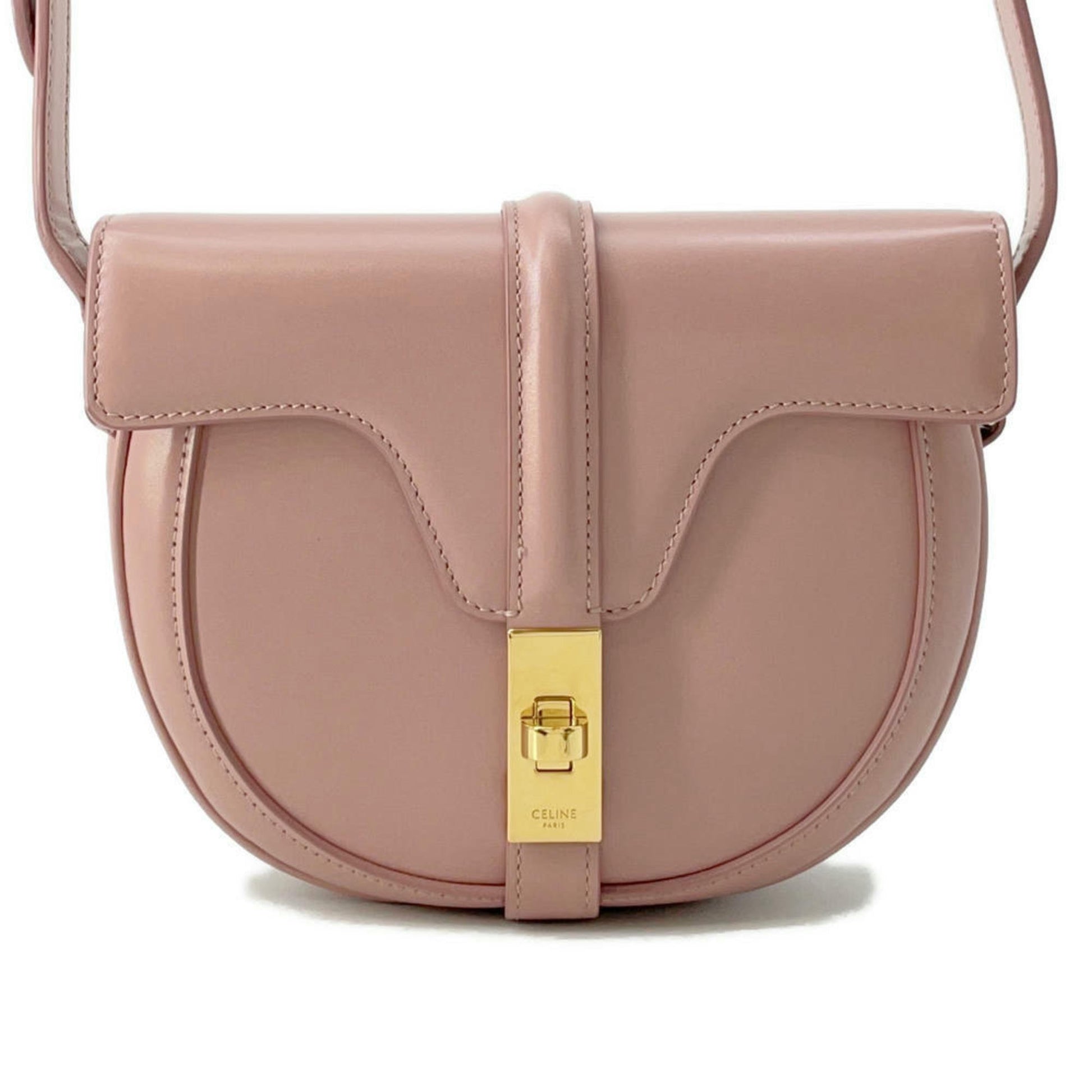 Celine pre-loved pink leather crossbody bag with gold clasp detail and curved design
