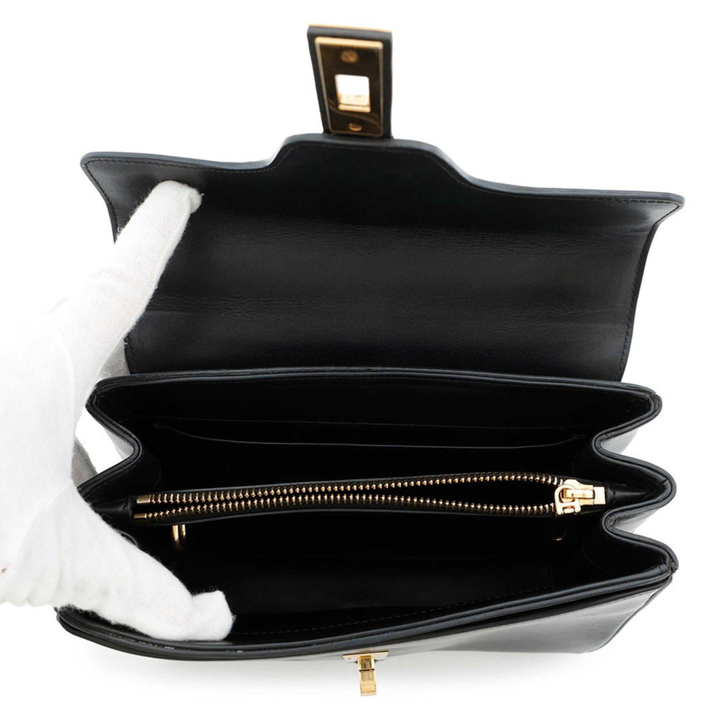 Inside view of a CÉLINE Pre owned 16 Seize handbag showing spacious compartments and zipper pocket