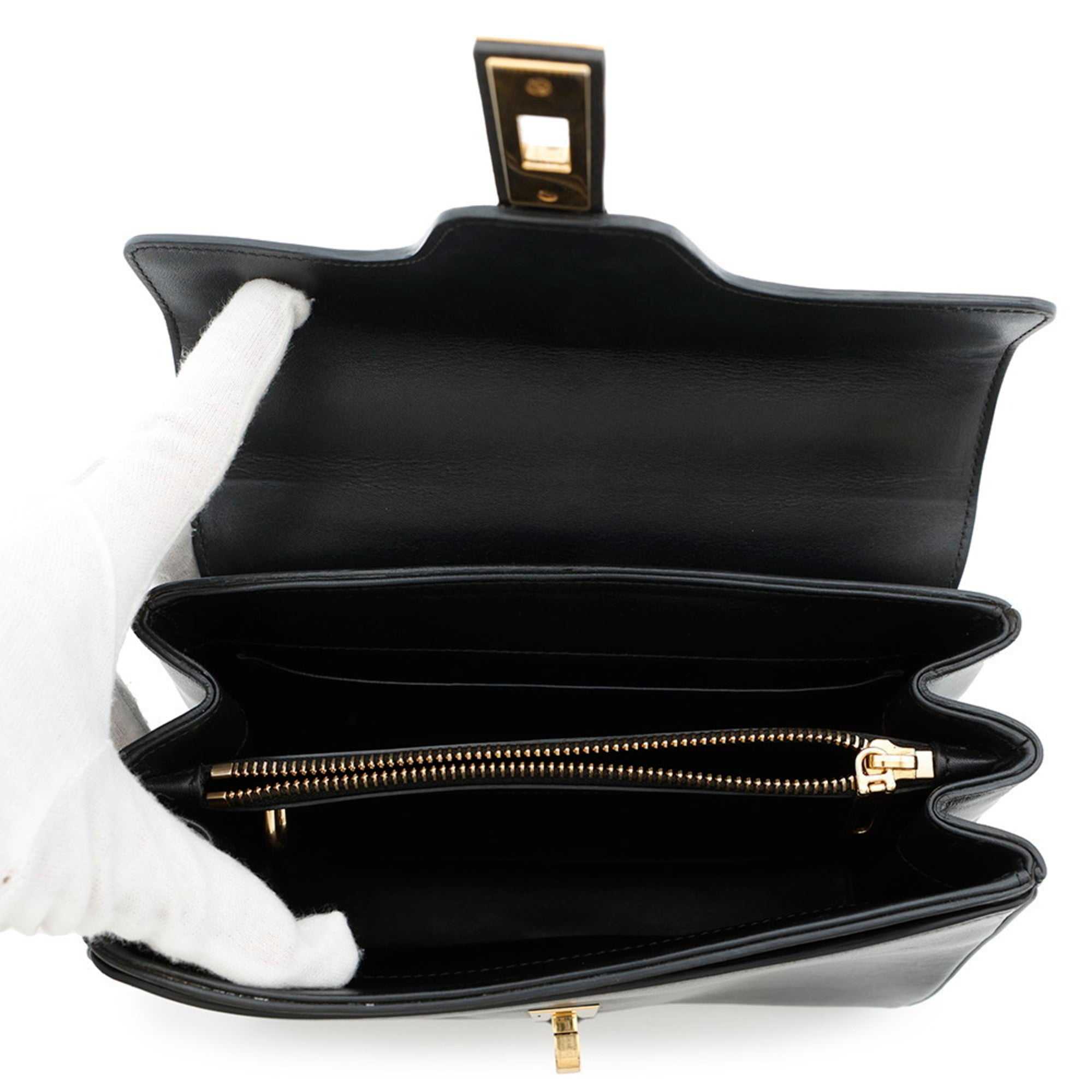 Inside view of a CÉLINE Pre owned 16 Seize handbag showing spacious compartments and zipper pocket
