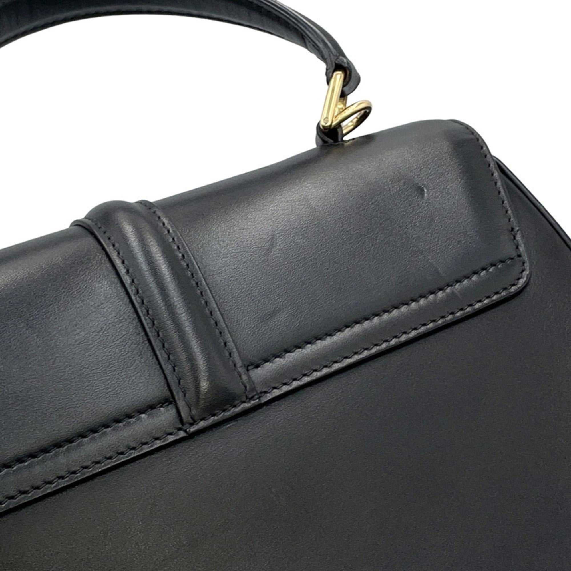 CÉLINE Pre owned 16 Seize Black Leather Handbag with Gold Accents and Structured Design