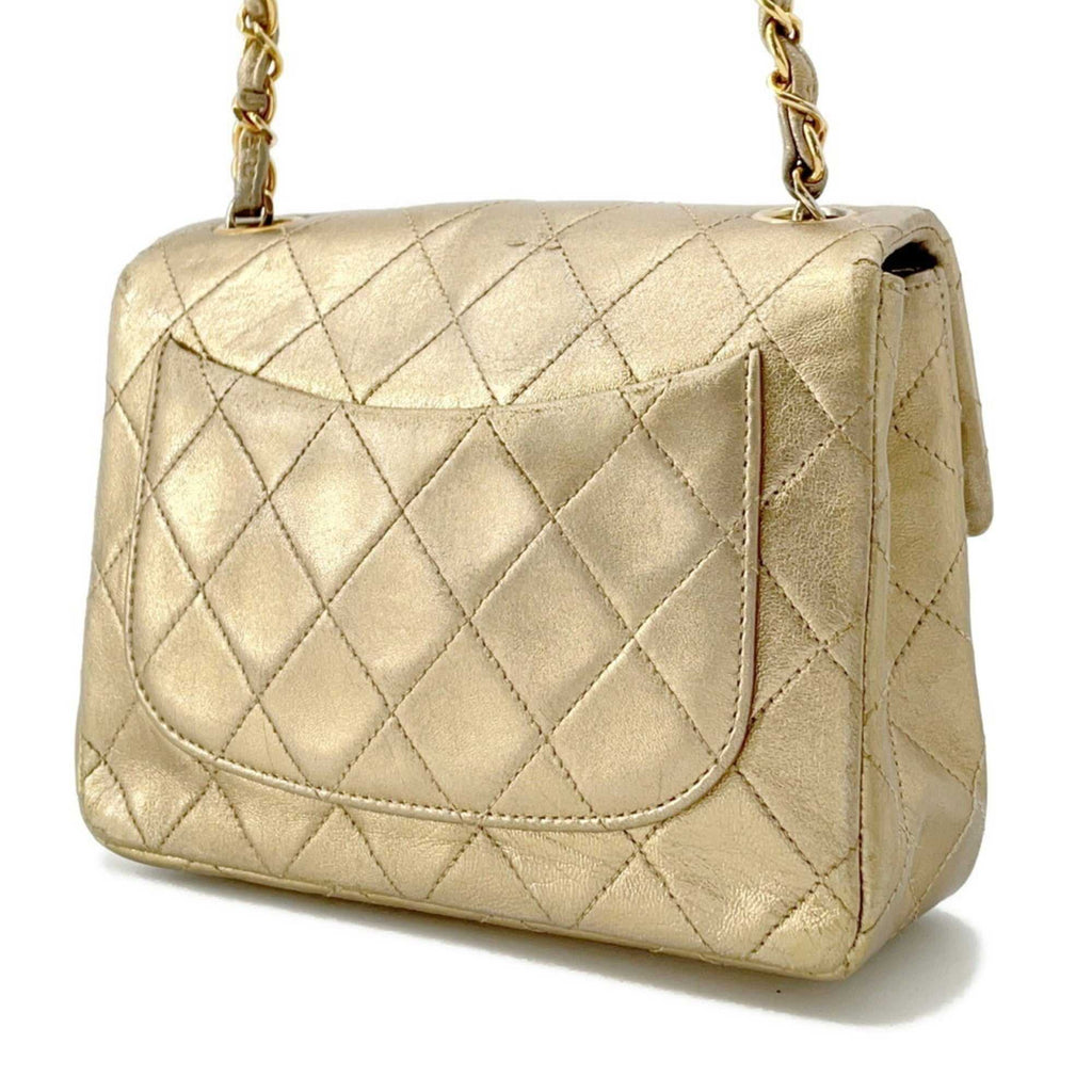 Authentic Chanel Matelasse 18 for sale in gold leather with classic quilted design and chain strap