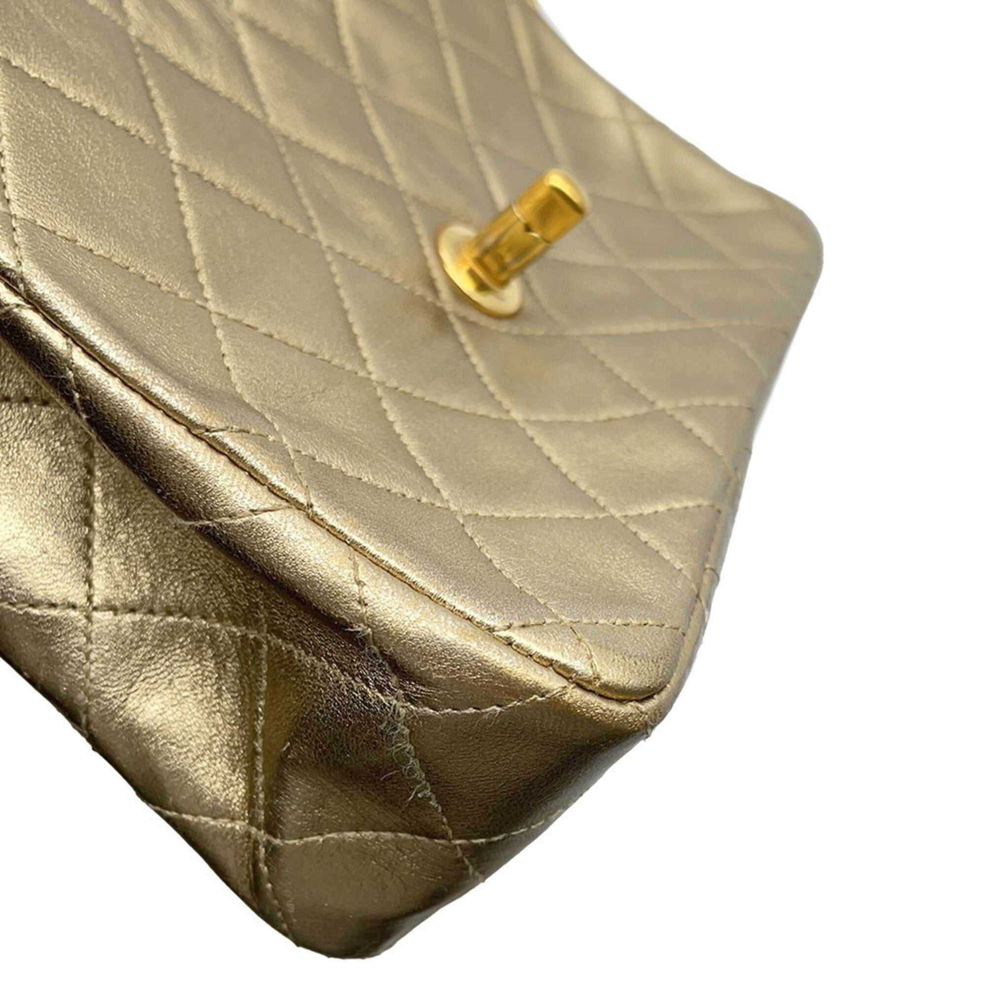 Close-up view of authentic Chanel Matelasse 18 for sale in gold leather with a quilted pattern
