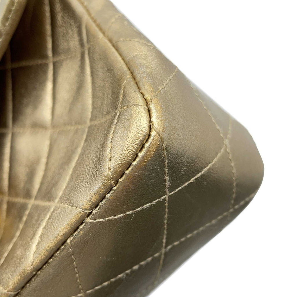 Close-up of authentic Chanel Matelasse 18 for sale showcasing the luxurious quilted texture and gold finish