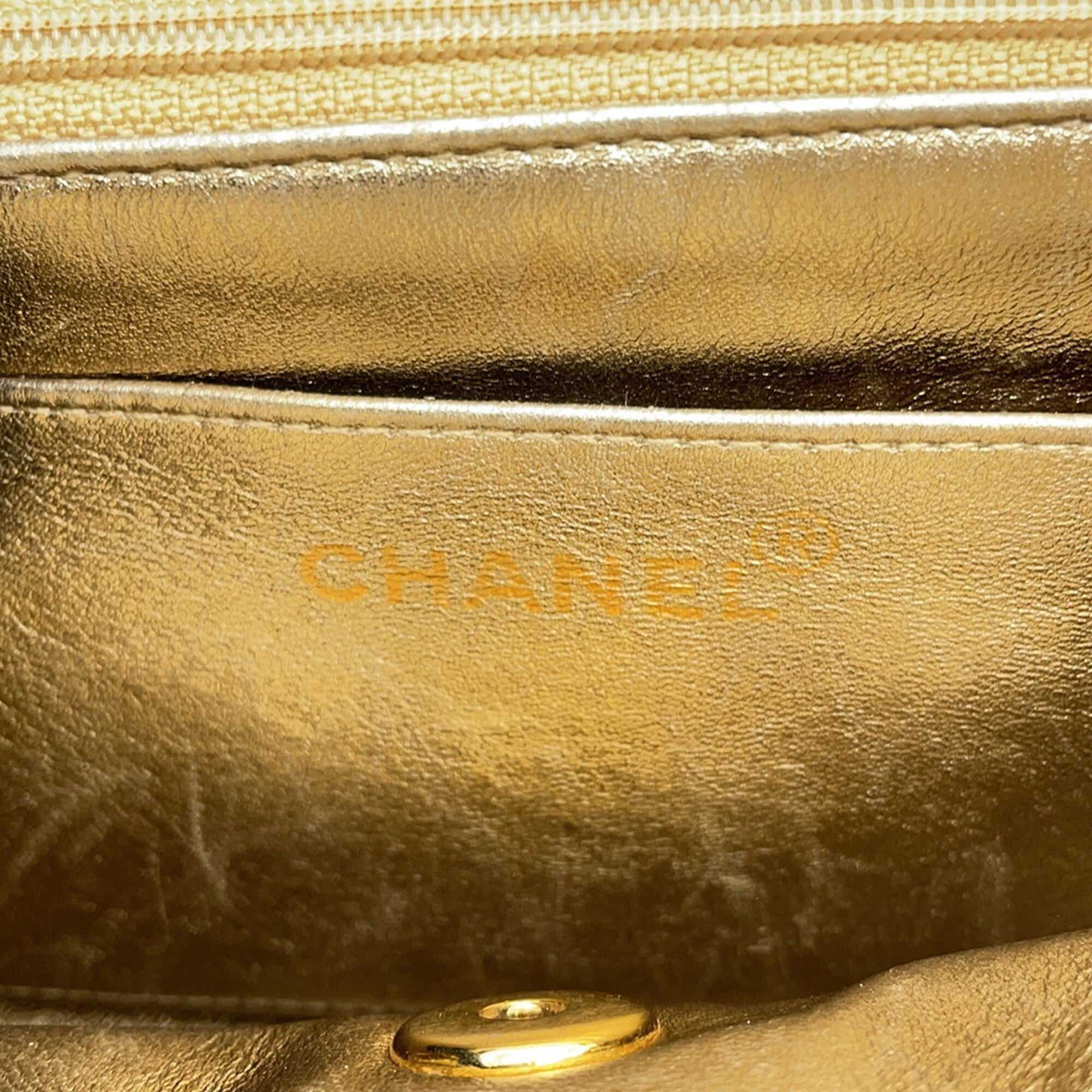 Inside view of authentic Chanel Matelasse 18 for sale featuring luxurious gold leather lining