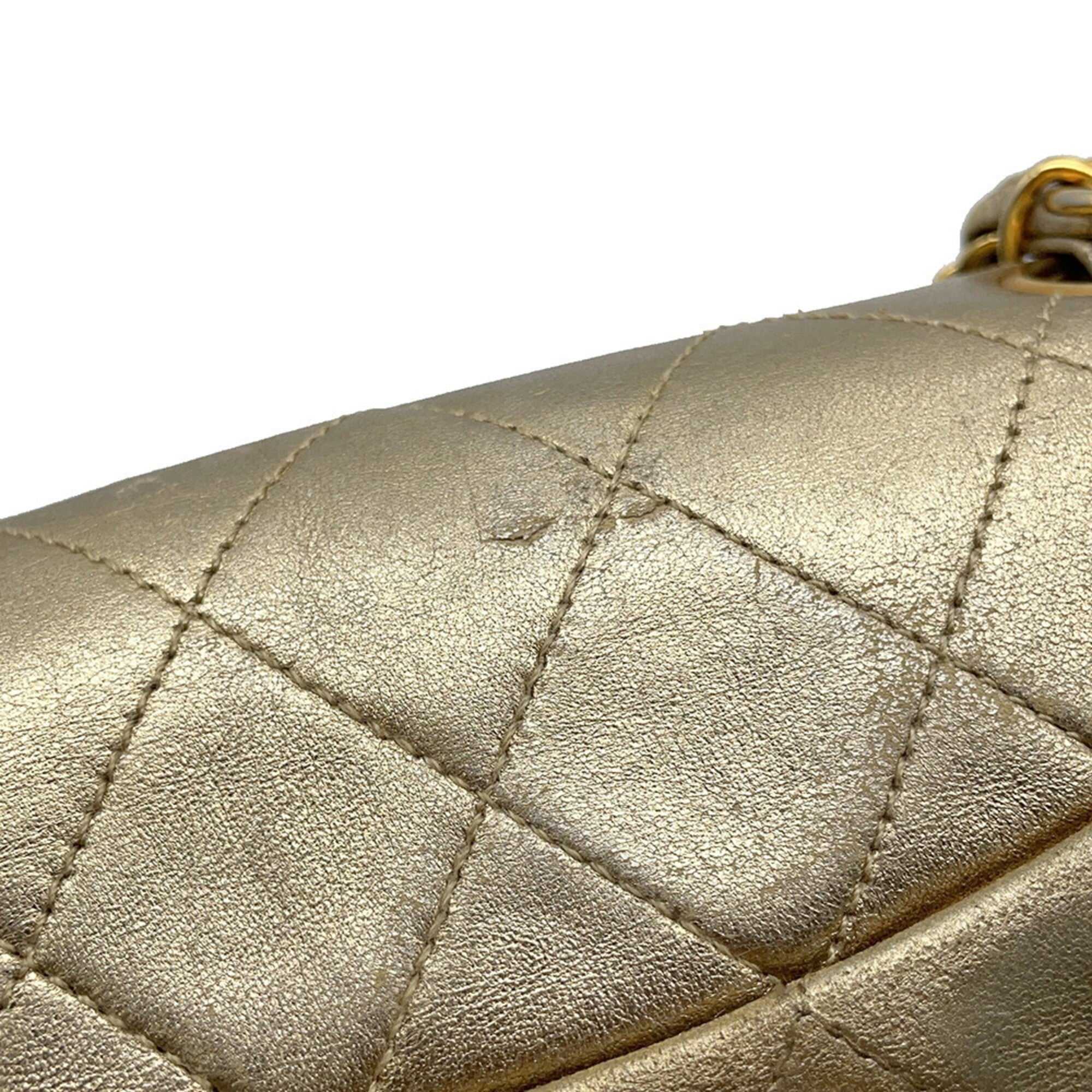 Close-up of the authentic Chanel Matelasse 18 for sale showcasing luxurious quilted texture and gold finish