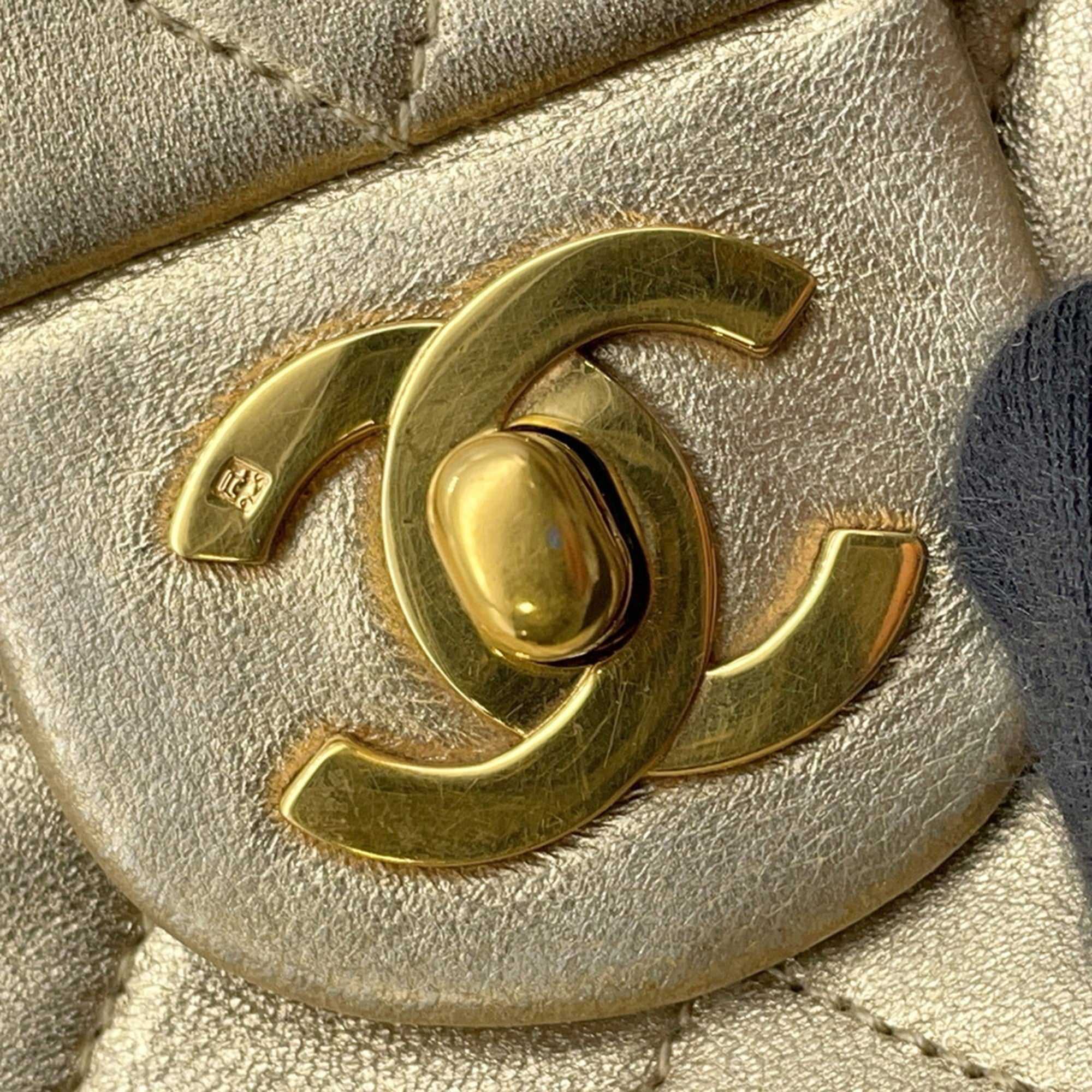 Close-up of authentic Chanel Matelasse 18 for sale featuring gold hardware and quilted leather design