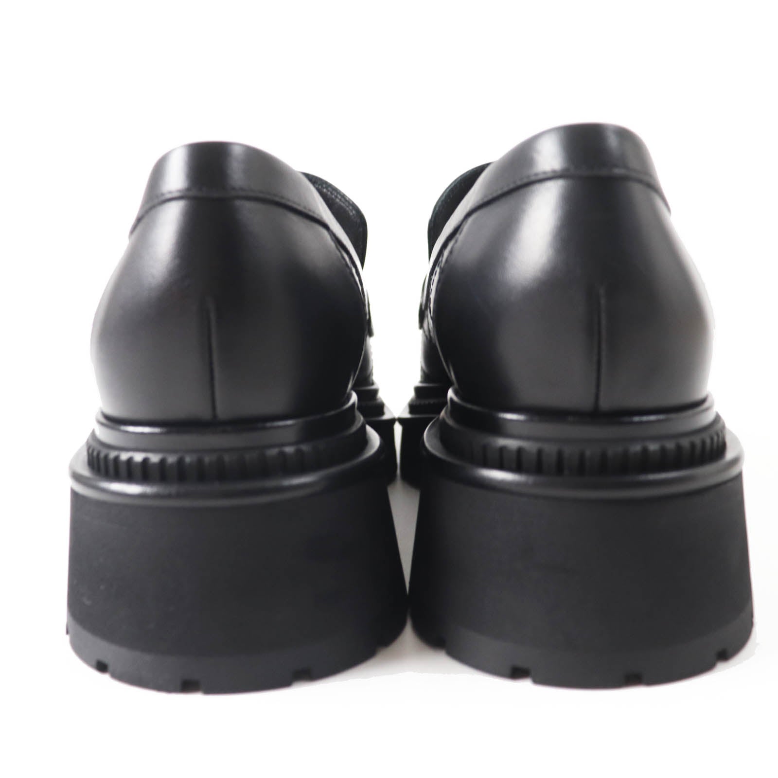 Used Chanel loafers women with a sleek black design and chunky sole for stylish comfort