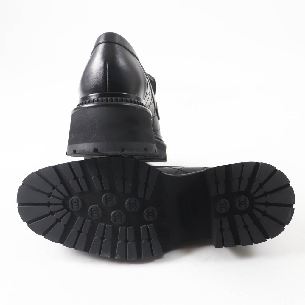 Sole view of used Chanel loafers women with a chunky tread and elegant design for stylish comfort