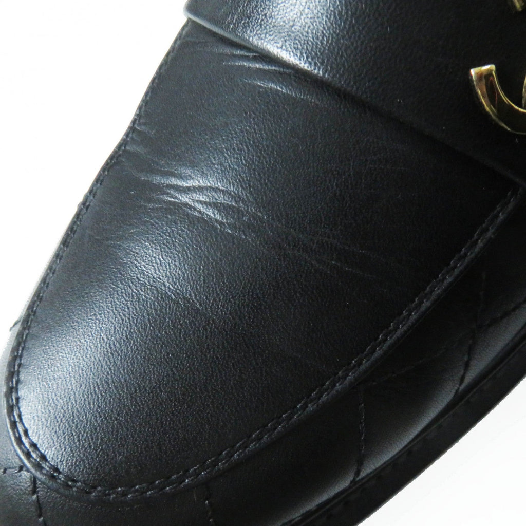 Used Chanel loafers women in black leather featuring a quilted design and signature logo detail