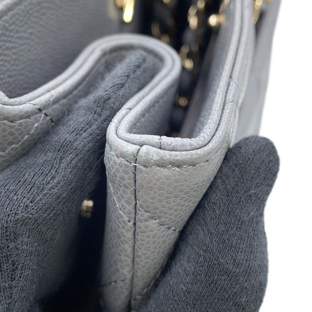 Interior view of a luxury designer tote bag Chanel featuring quilted leather and elegant design details