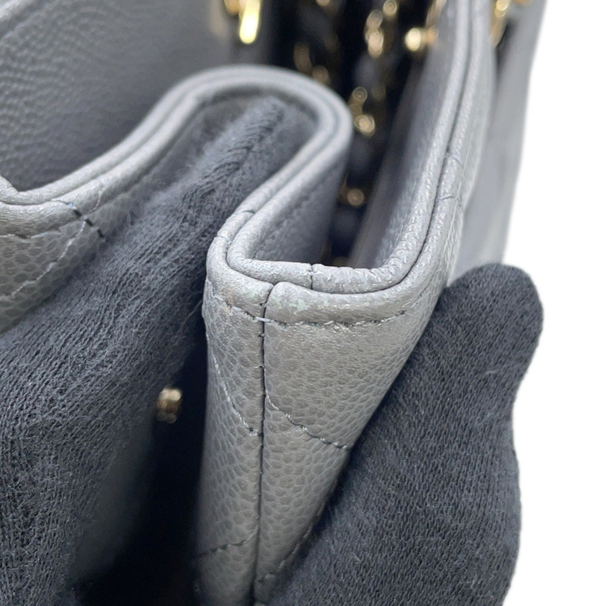 Interior view of a luxury designer tote bag Chanel featuring quilted leather and elegant design details