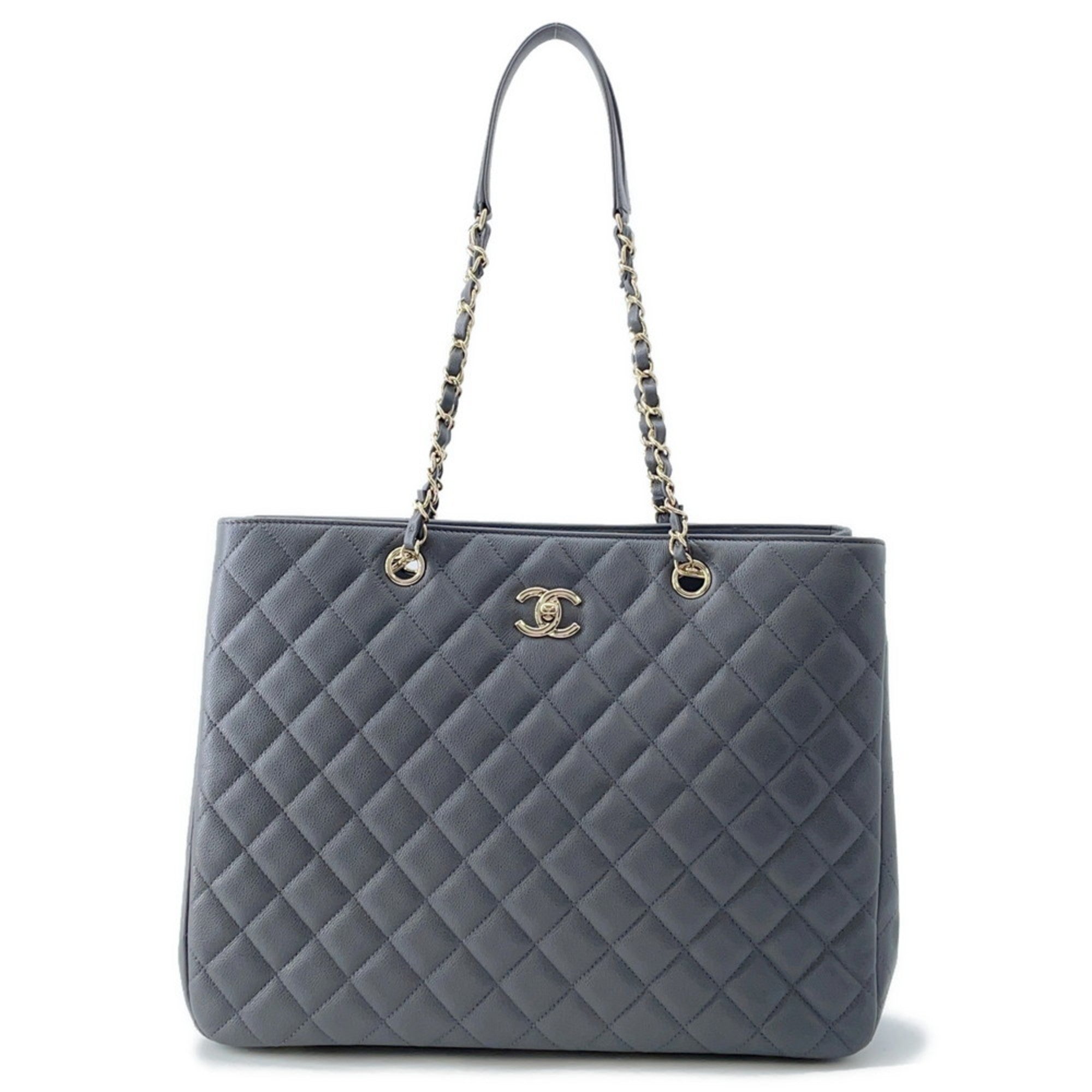 Luxury designer tote bag Chanel in gray with quilted pattern and chain straps