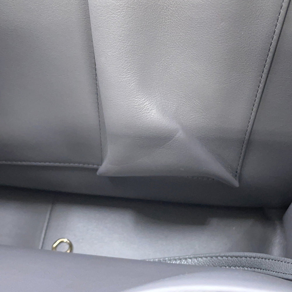 Interior view of a luxury designer tote bag Chanel featuring soft leather and spacious design
