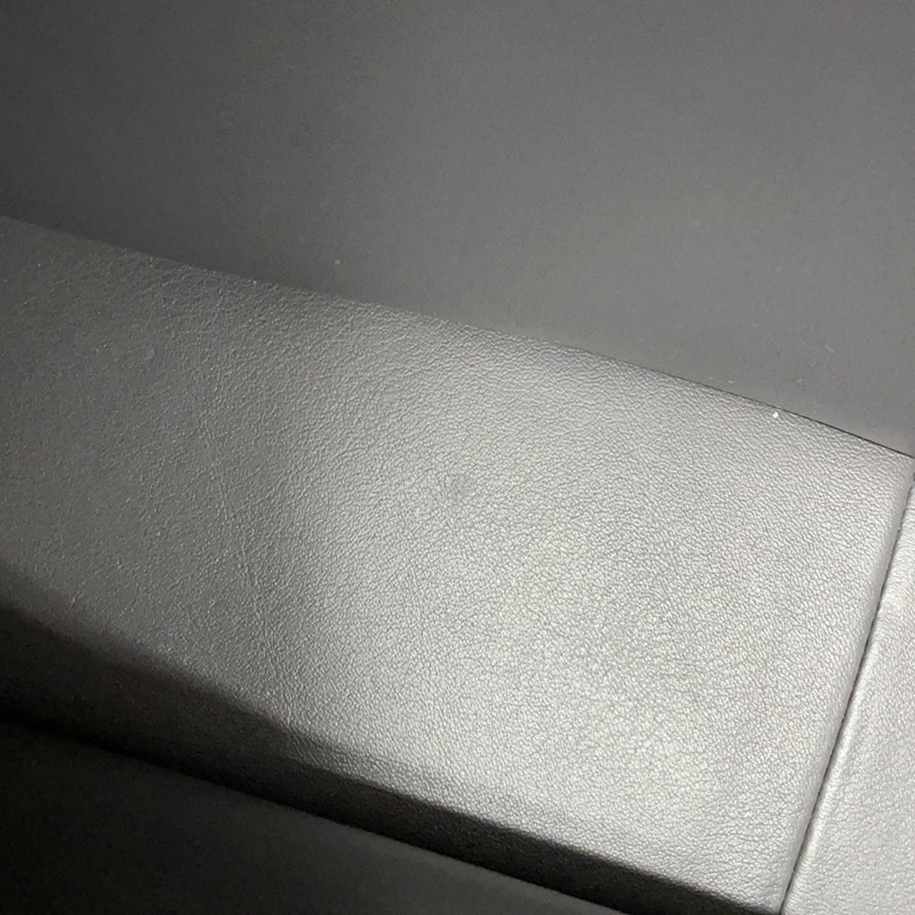 Close-up of the textured leather surface of a luxury designer tote bag Chanel