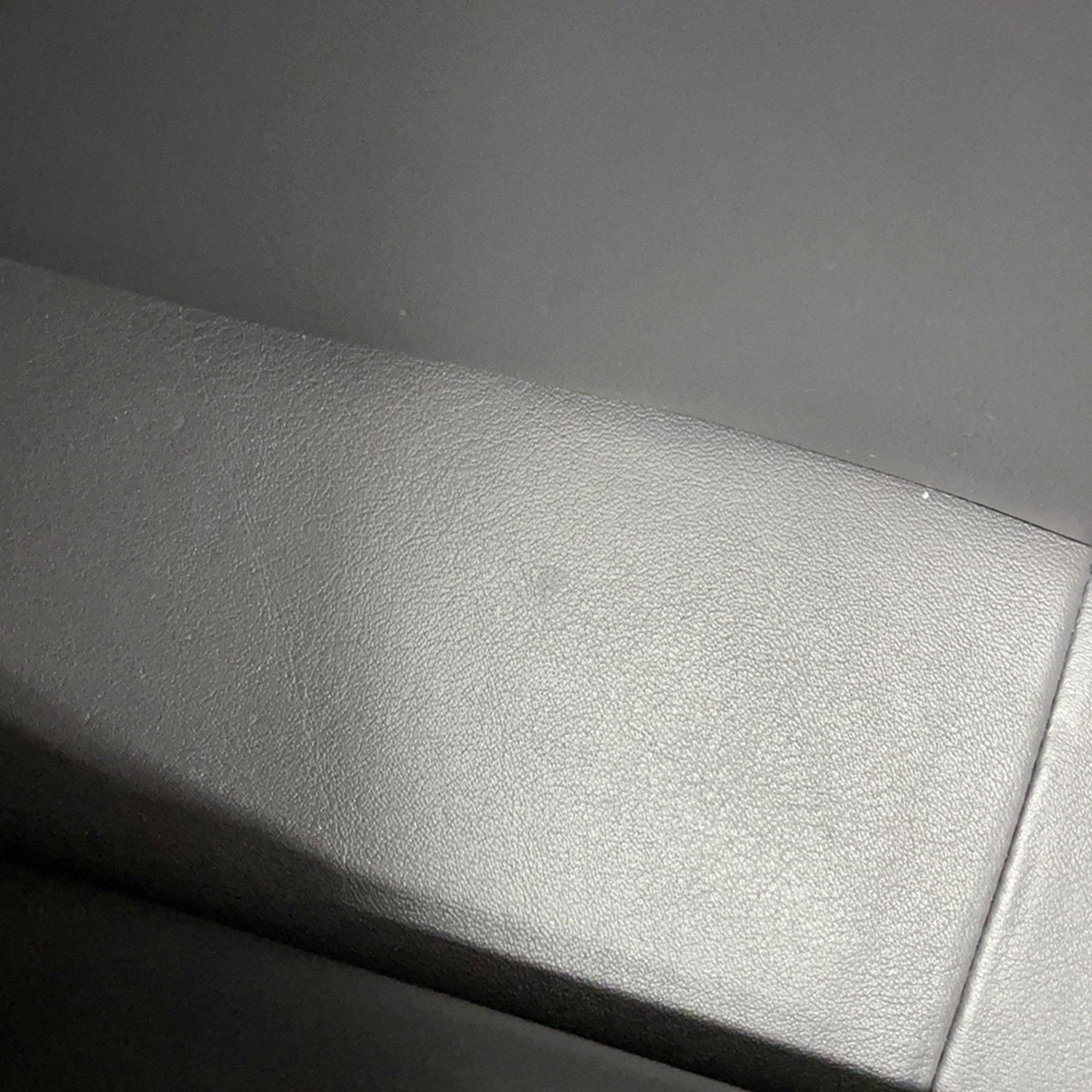 Close-up of the textured leather surface of a luxury designer tote bag Chanel