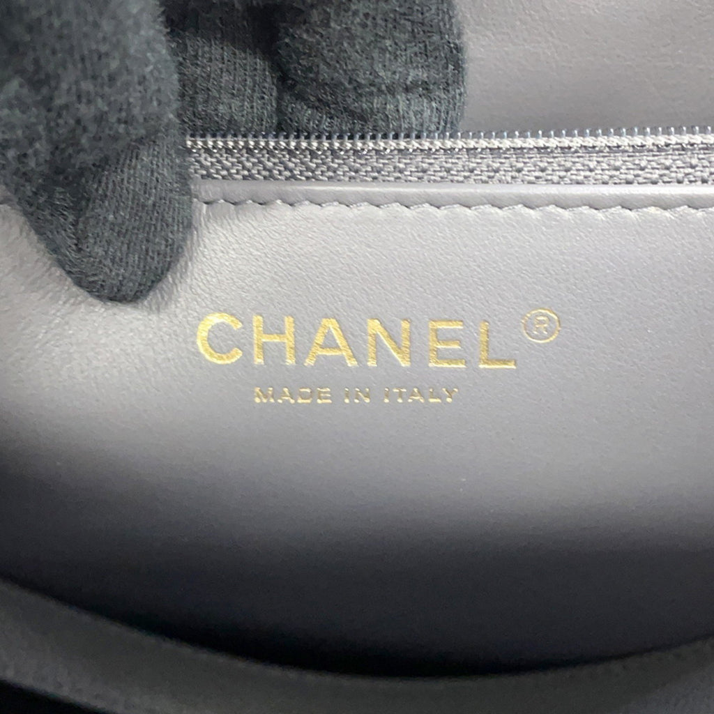 Close-up of luxury designer tote bag Chanel interior showing logo and craftsmanship details