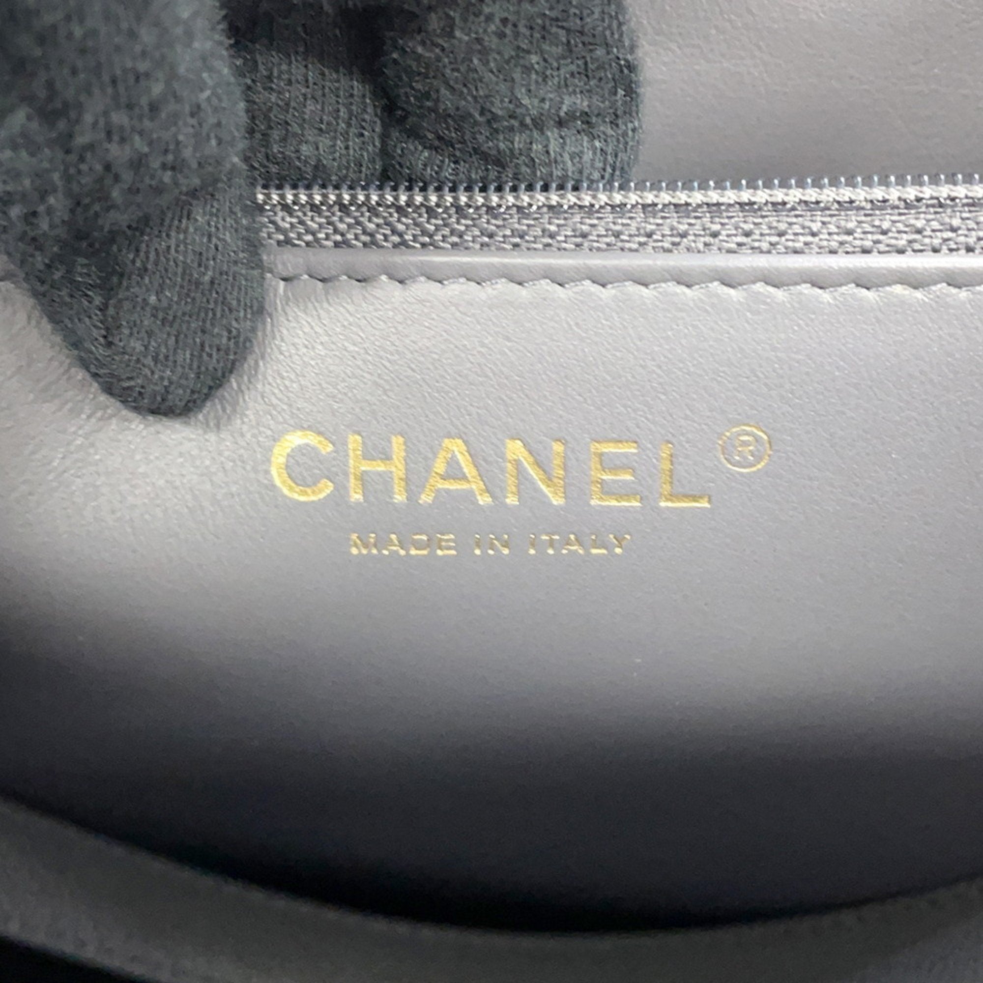 Close-up of luxury designer tote bag Chanel interior showing logo and craftsmanship details