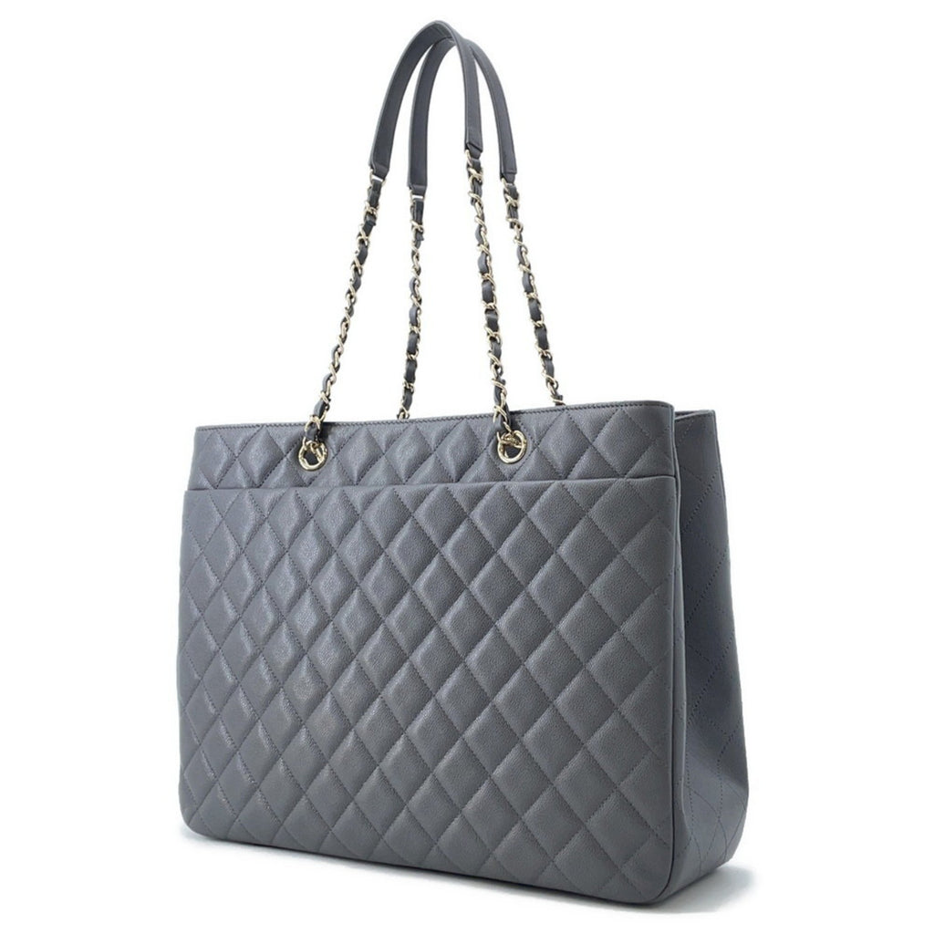 Luxury designer tote bag Chanel in gray quilted leather with chain straps for elegant style