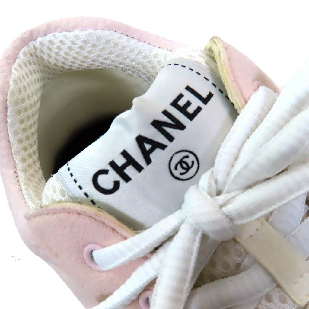 Close-up of Chanel pink sneakers for women showcasing soft materials and logo detail