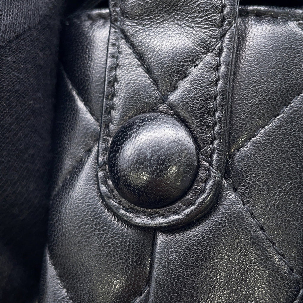 Close-up of MANSII CHANEL Pre-Loved Matelasse Full Flap bag showing quilted texture and button detail