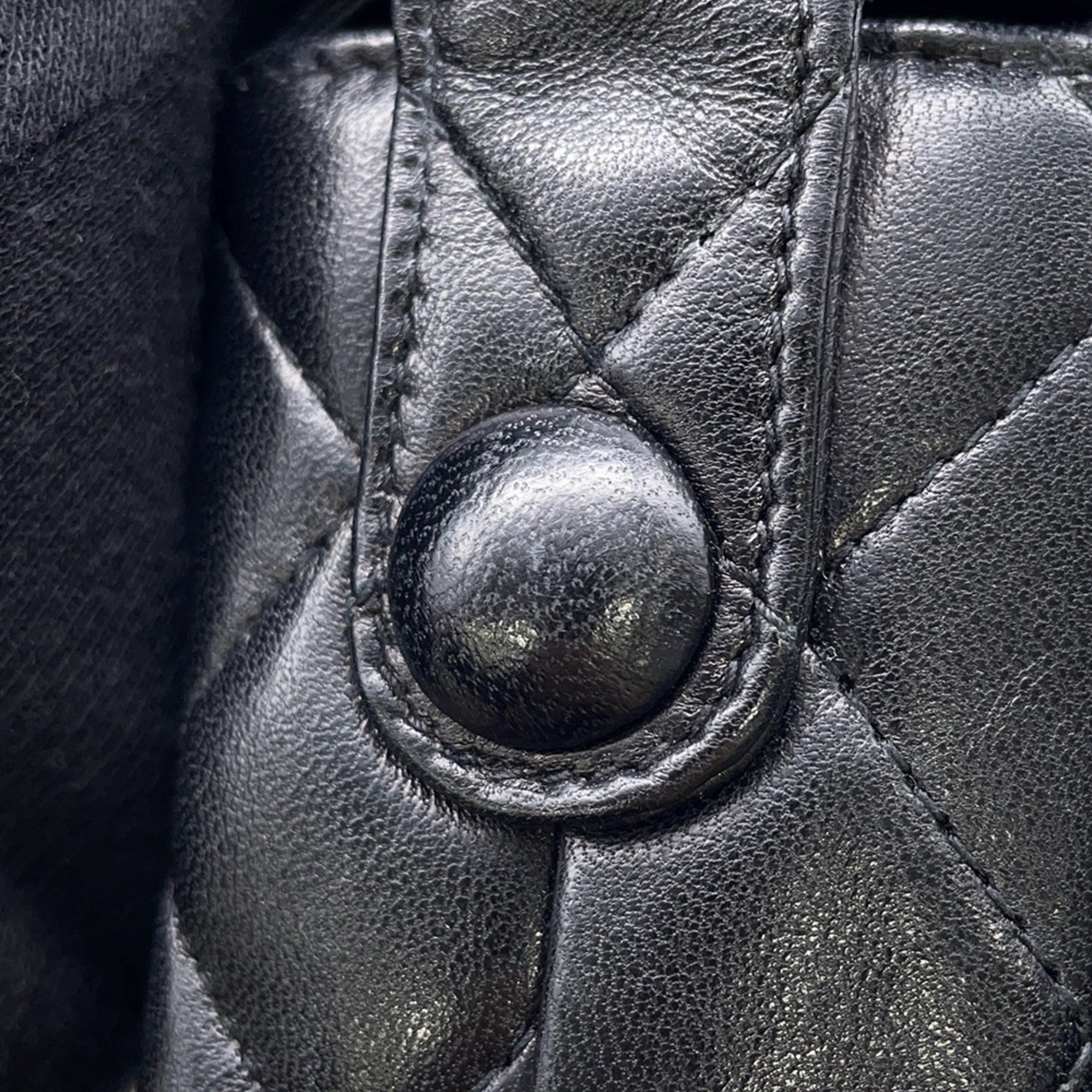 Close-up of MANSII CHANEL Pre-Loved Matelasse Full Flap bag showing quilted texture and button detail