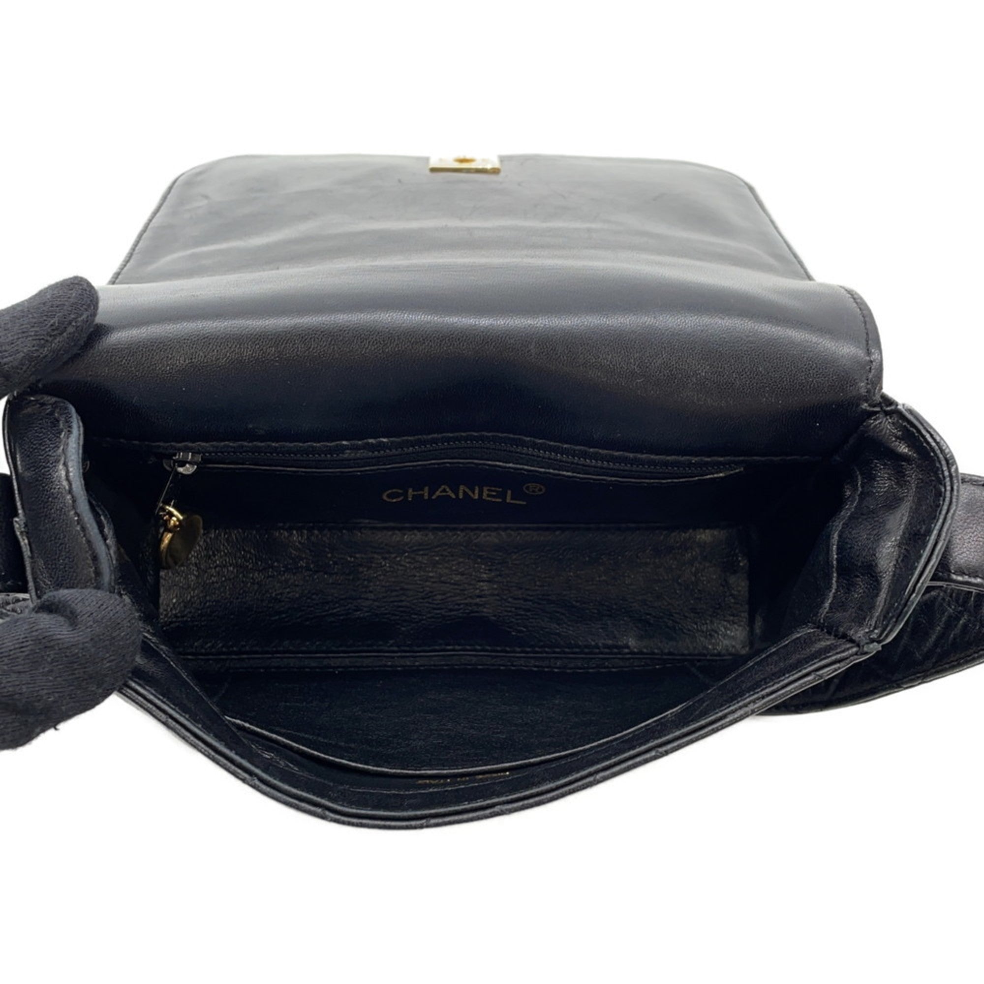 Interior view of CHANEL Pre-Loved Matelasse Full Flap handbag showcasing its spacious design and signature logo